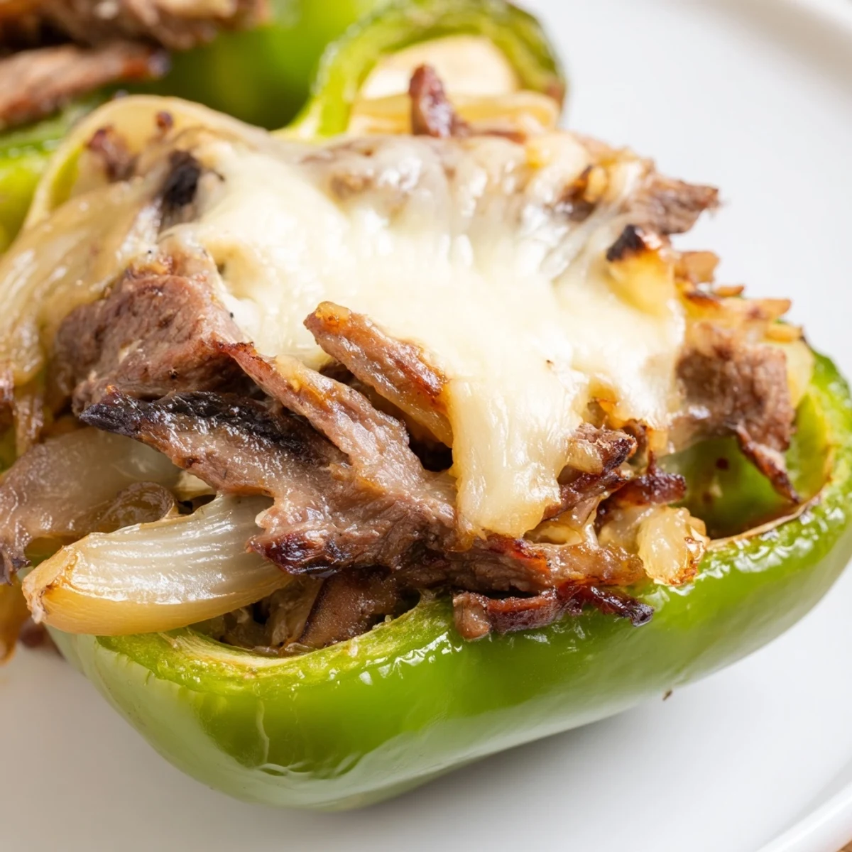 Tender green bell peppers filled with juicy beef, mushrooms, and melted provolone cheese.