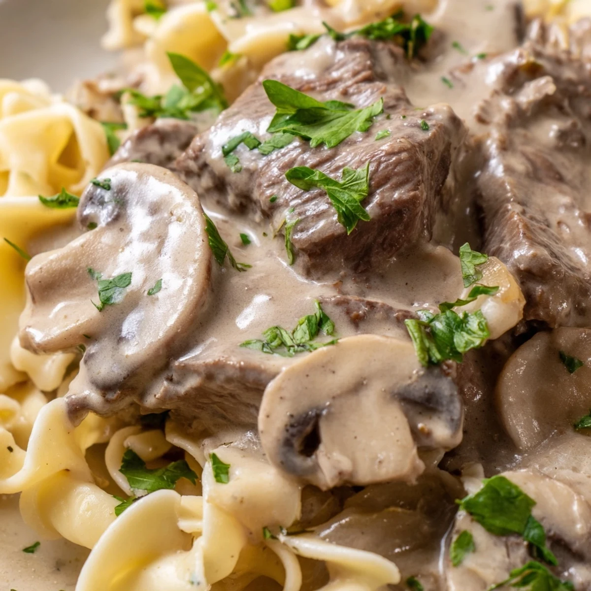 Golden brown beef strips and sautéed mushrooms smothered in creamy Beef and Mushroom Stroganoff, served over buttery egg noodles.