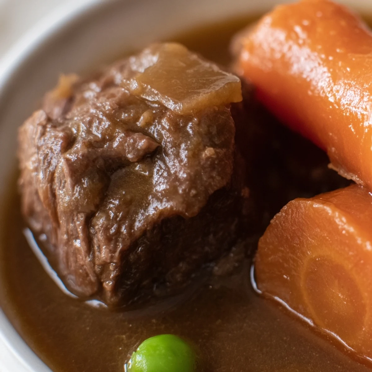 This rustic Slow Cooker Beef Stew with Vegetables is served in a deep bowl, garnished with fresh parsley and ready for crusty bread.