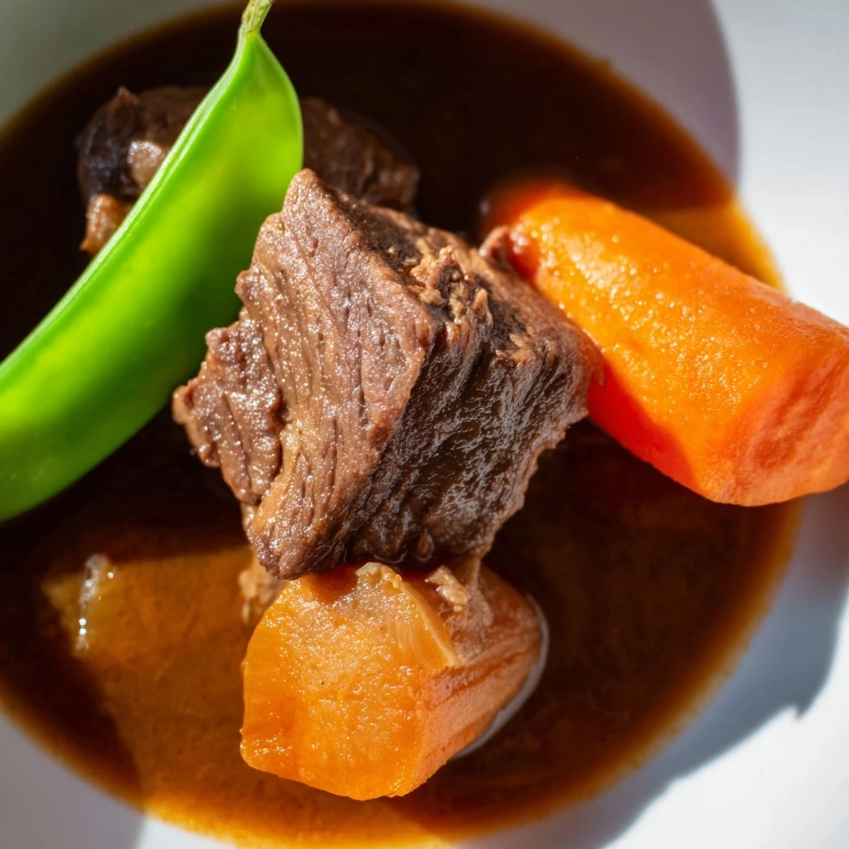 Slow Cooker Beef Stew with Vegetables steams in the pot, releasing aromas of thyme and rosemary, perfect for a cozy family dinner.