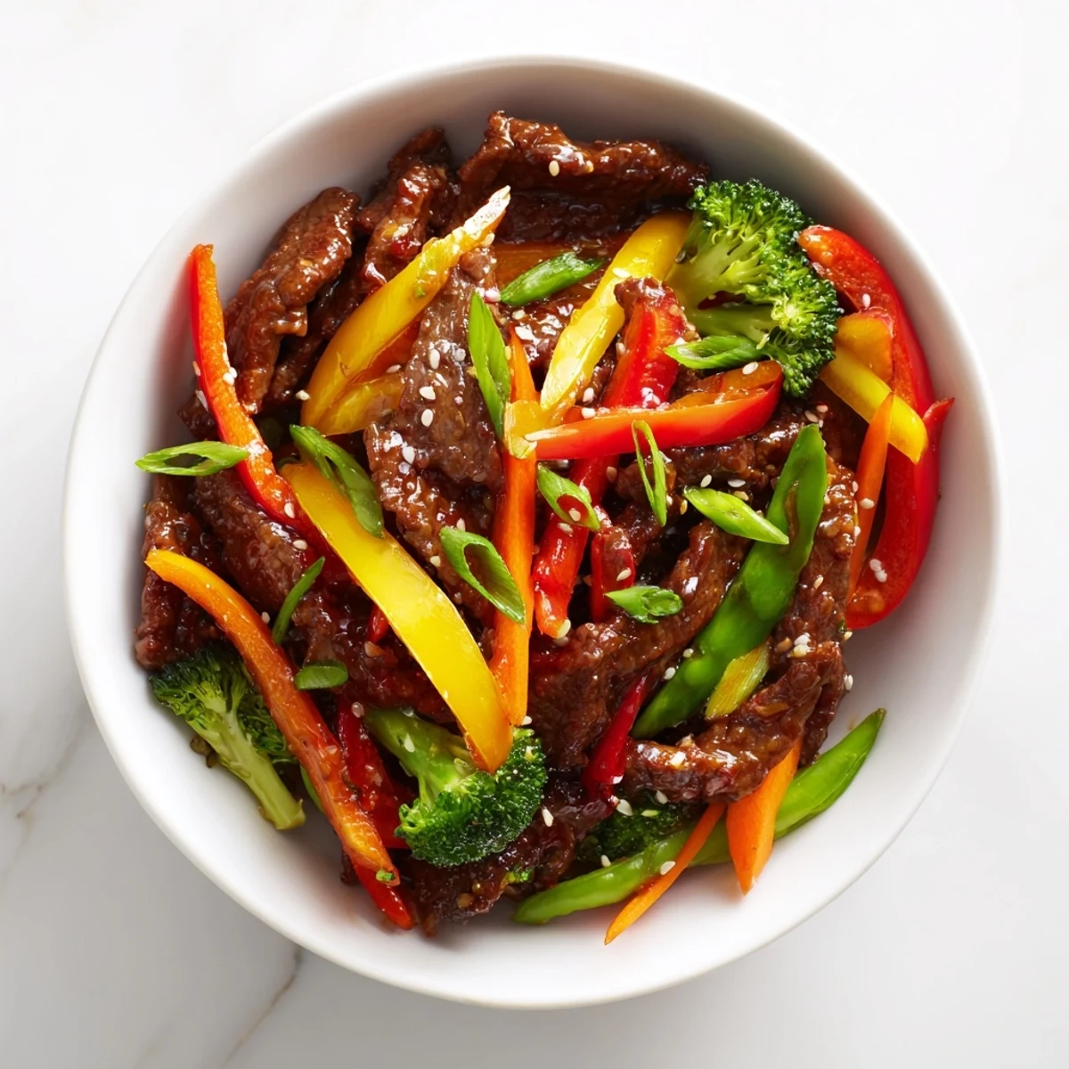 Sizzling beef, snap peas, and bell peppers tossed in a bold chili garlic sauce. Spicy Beef Stir Fry with Vegetables ready for a weeknight dinner.