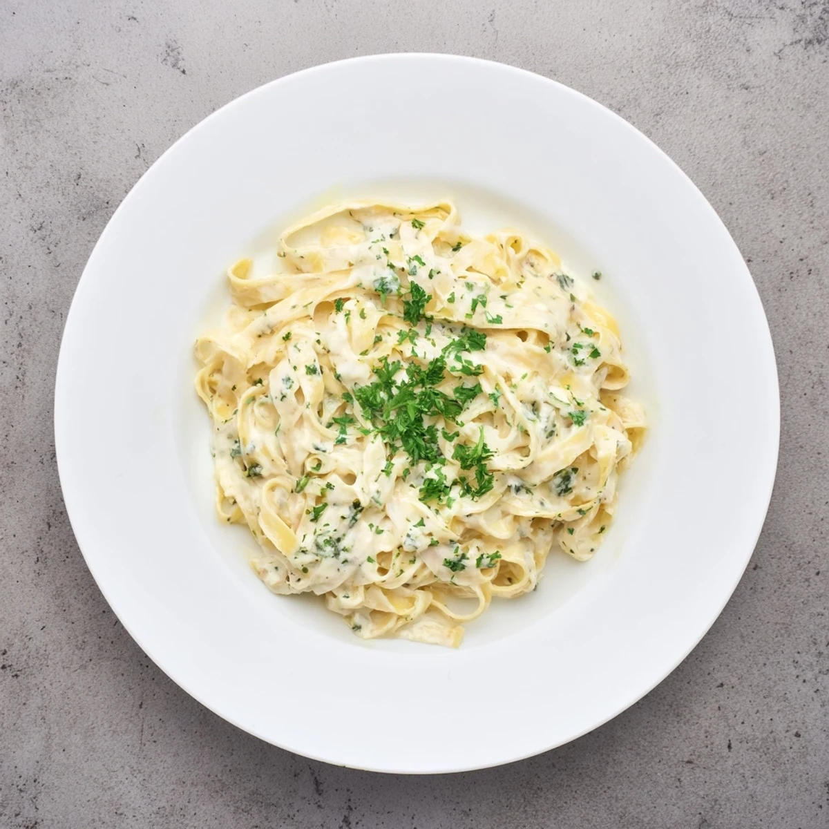 Creamy Garlic Pasta with Parsley is tossed in a velvety garlic sauce and garnished with fresh parsley for a bright, aromatic finish.  