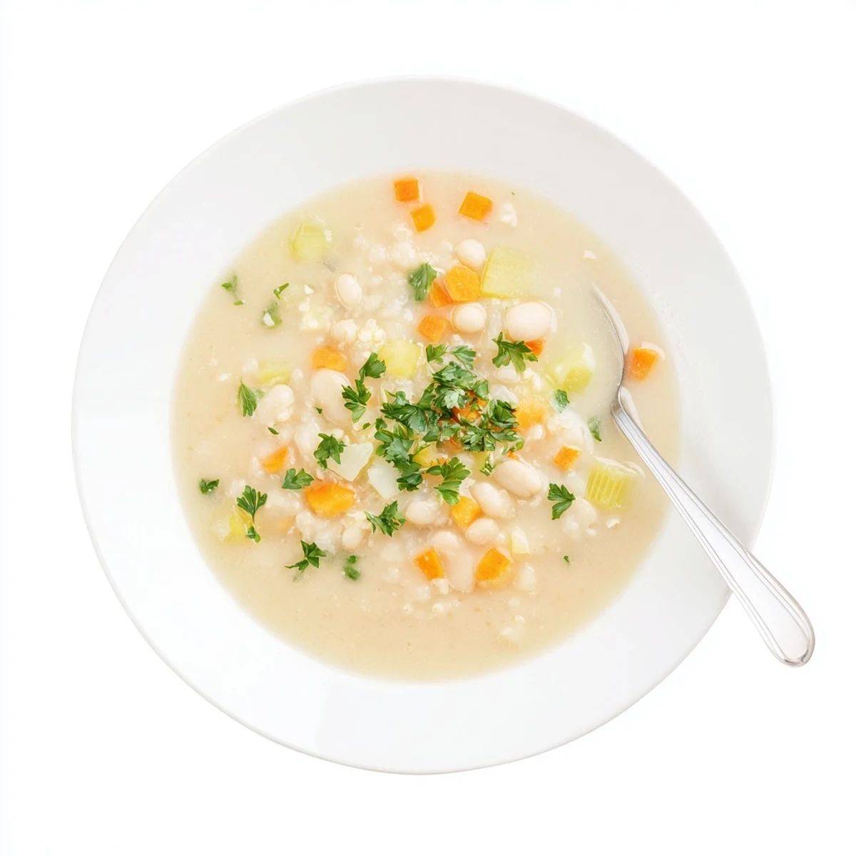 Creamy Cozy Rosemary Garlic White Bean Soup garnished with fresh parsley and lemon.