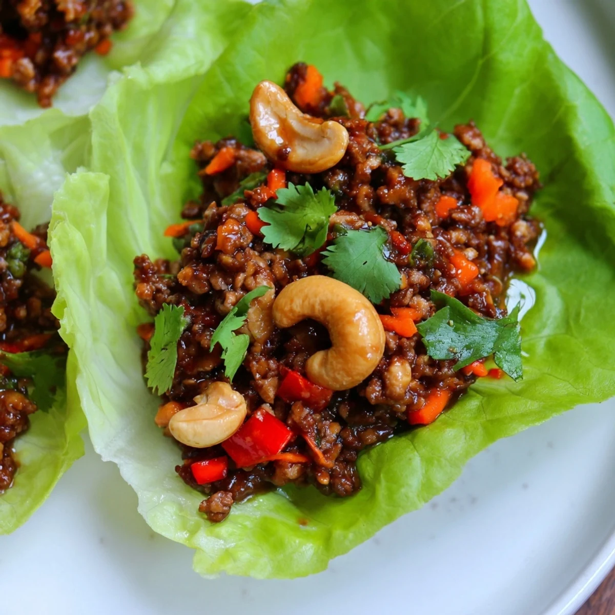 Crisp butter lettuce cups filled with savory seasoned ground beef and crunchy roasted cashews