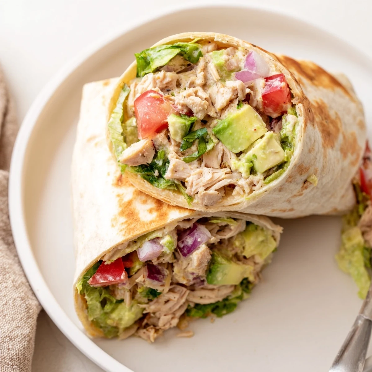 Warm Chicken Avocado Ranch Burritos toasted golden, served with zesty ranch dipping sauce