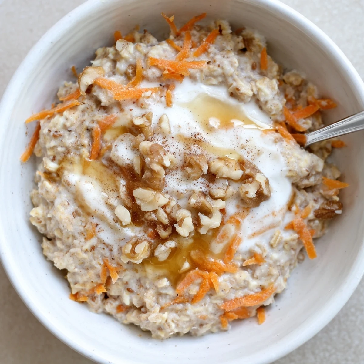 Chilled Carrot Cake Overnight Oats showcasing grated carrot, warm cinnamon aroma