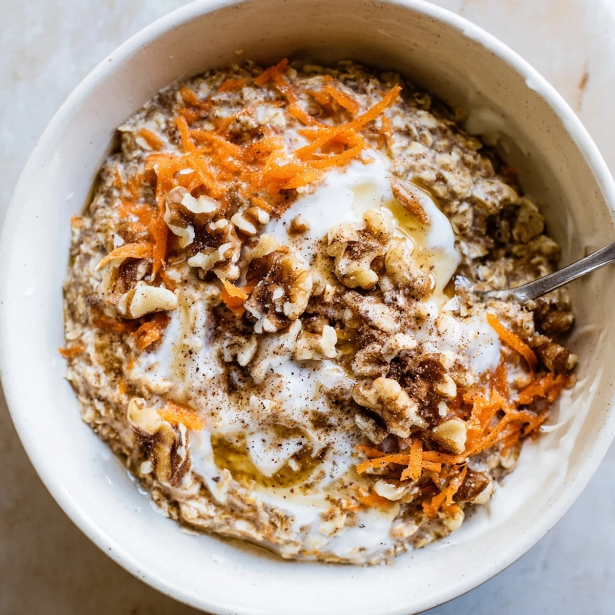 Make-ahead Carrot Cake Overnight Oats in mason jar, creamy, nut-studded breakfast