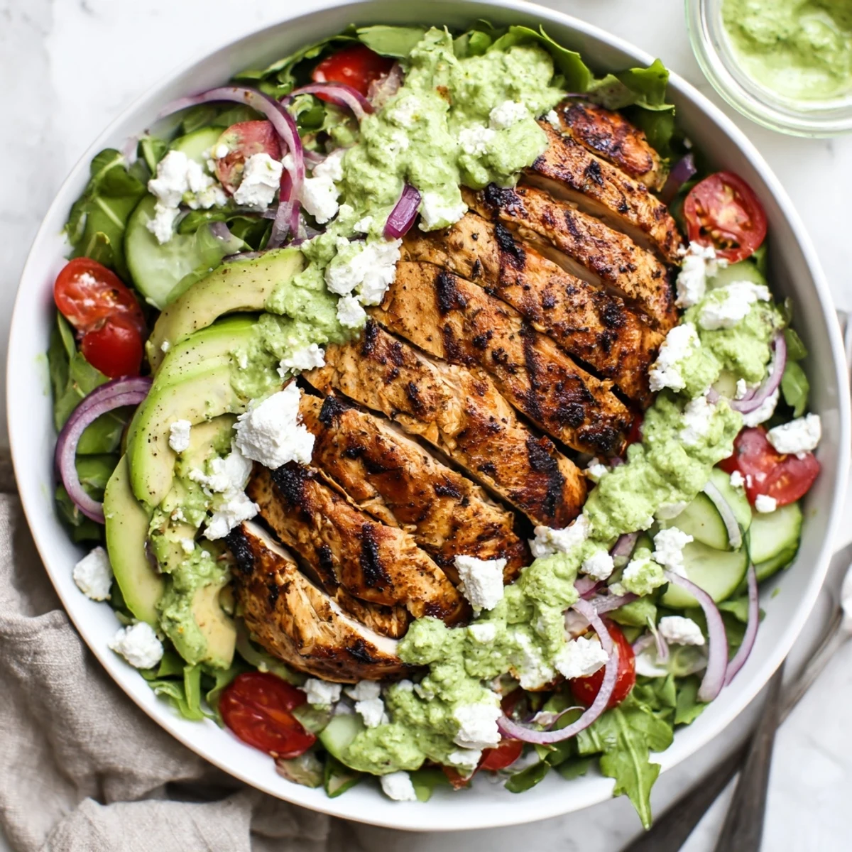 Grilled Chicken Salad Avocado Herb Dressing Recipe showing juicy sliced chicken over crisp greens